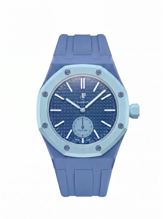 A blue and light blue wristwatch with a textured blue dial, light blue bezel, and blue silicone strap, shown against a plain white background.