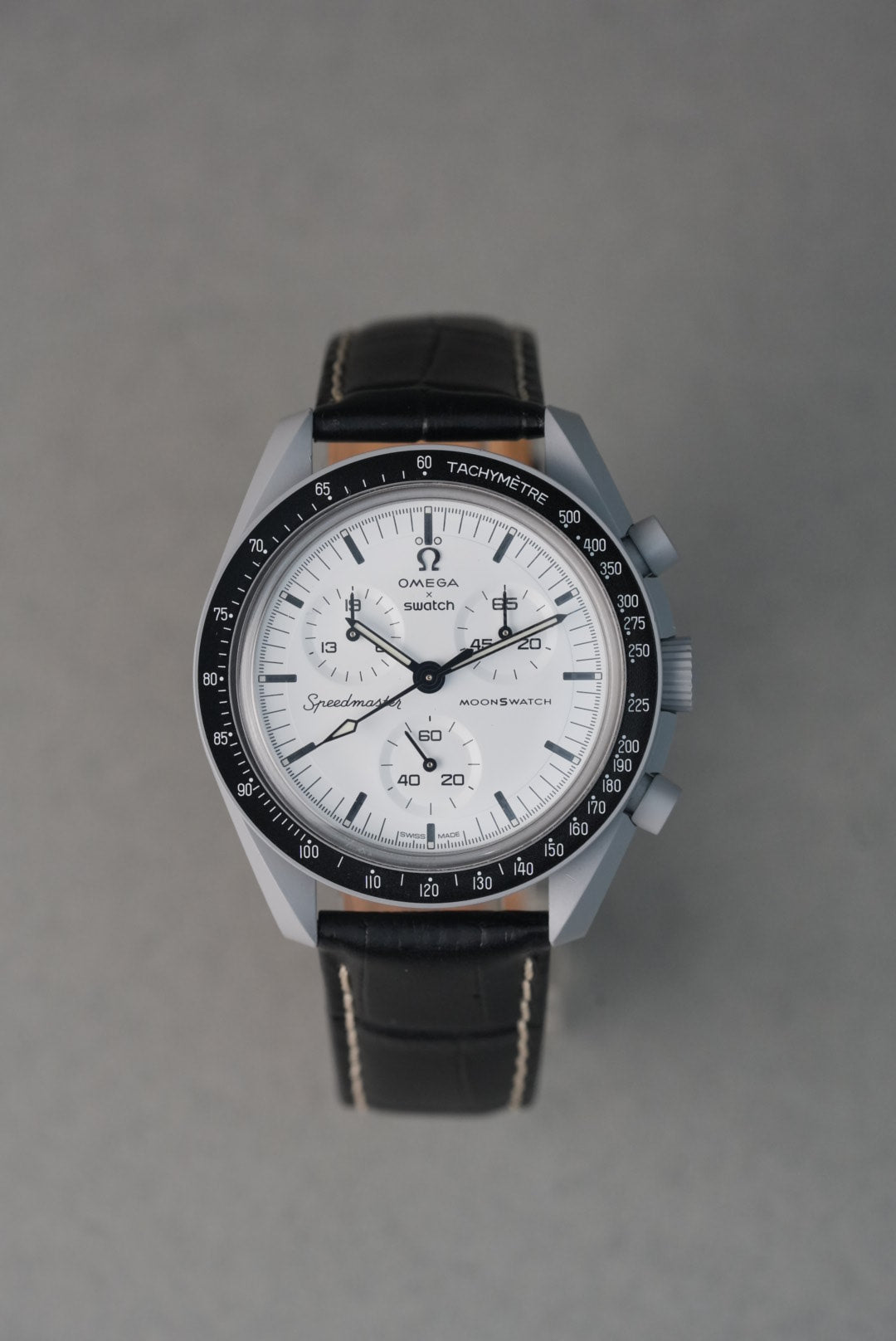 1965 moonswatch fitted with a black leather strap
