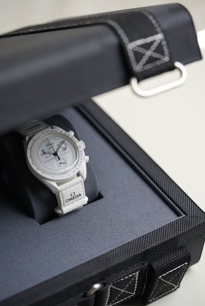 Luxury watch in a black display case on a white background