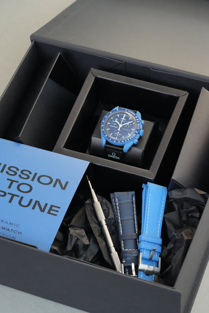 Blue watch with strap and pamphlet in a black box