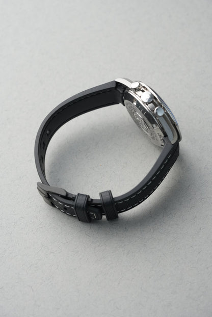 Black smartwatch on a light gray background