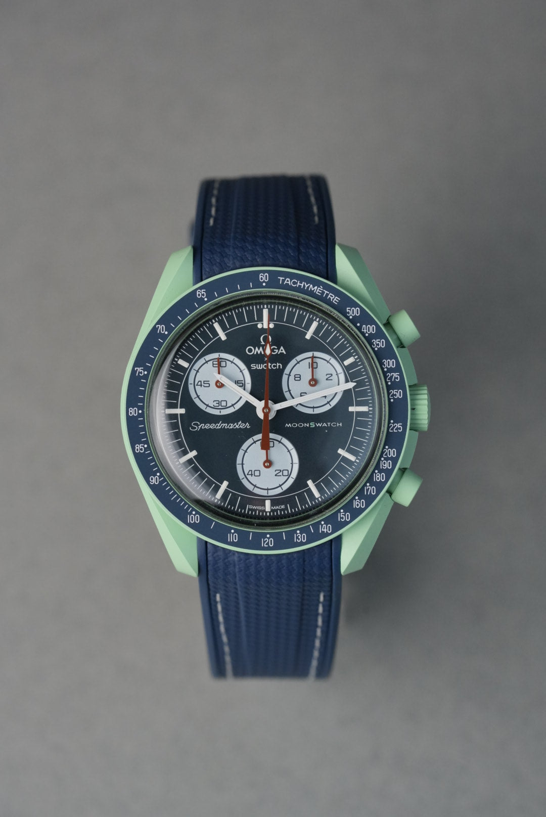 Textured navy rubber strap with white contrast stitching and curved ends, compatible with Omega x Swatch MoonSwatch.