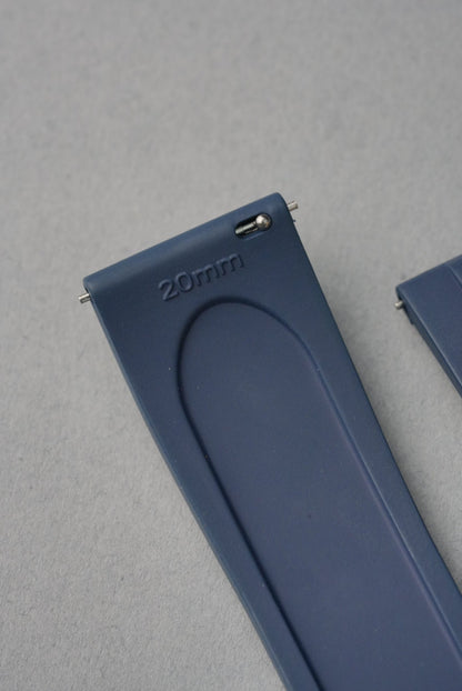 Blue watch strap with '20mm' marking on a gray background