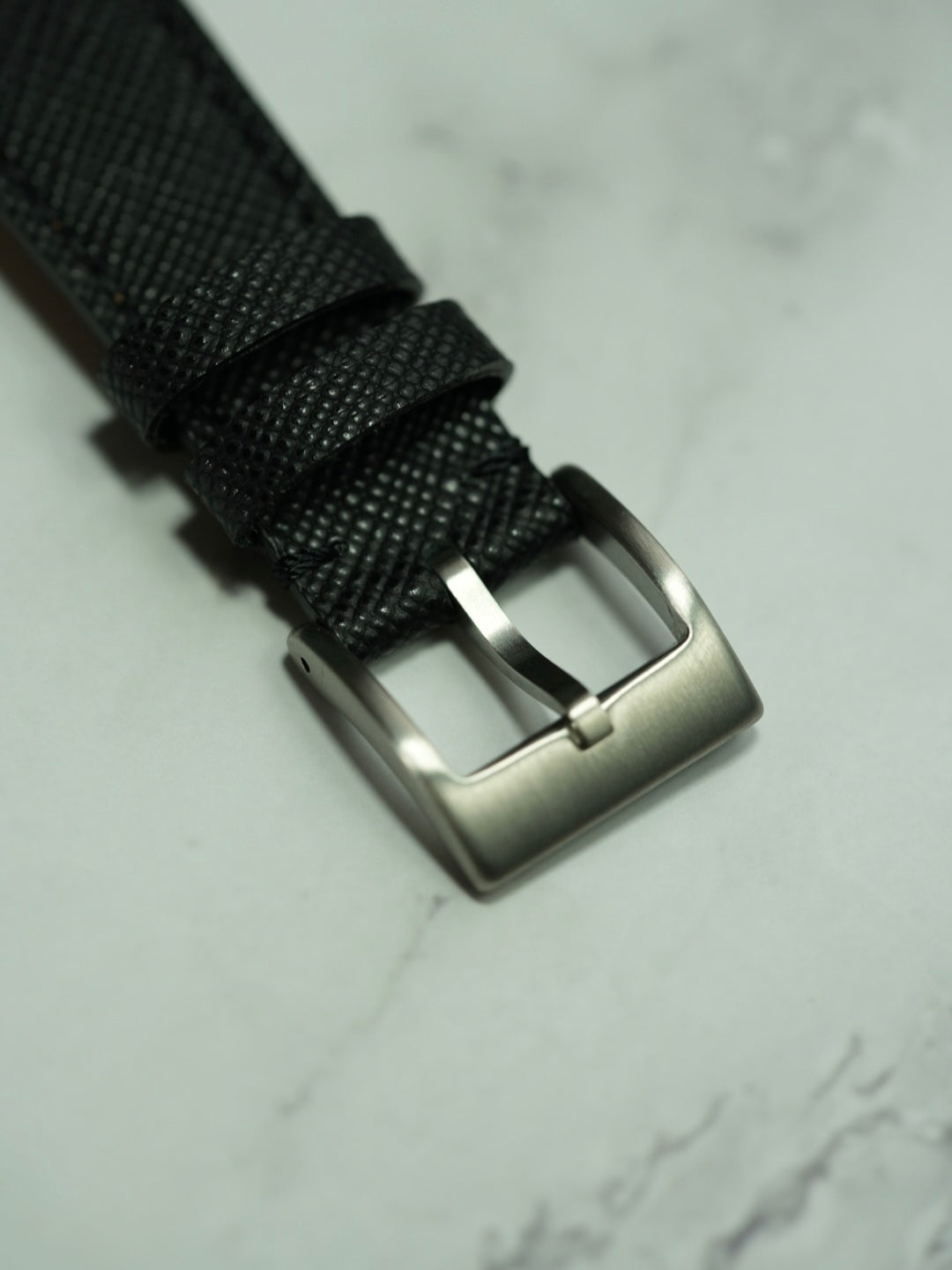 Brushed stainless steel buckle on Black Saffiano Leather watch strap