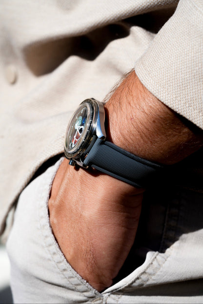 Close-up of a person wearing a smartwatch with a blurred background