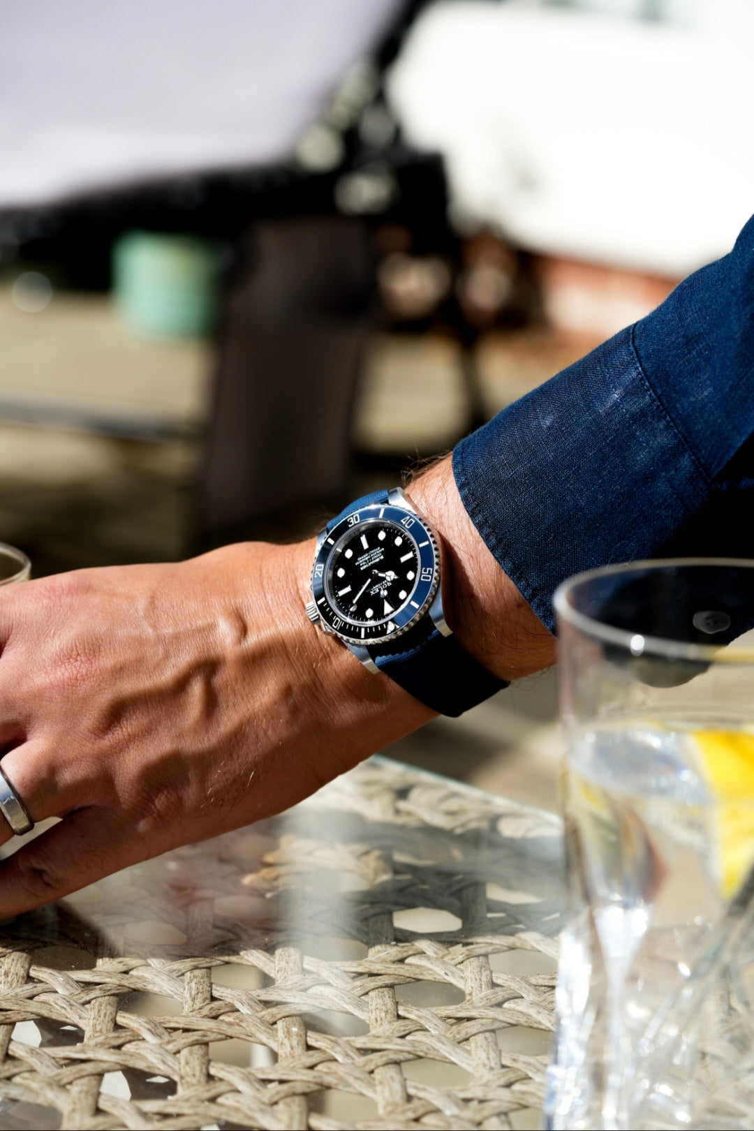 Person wearing a watch with a blurred background