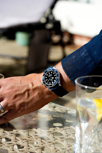 Person wearing a watch with a blurred background