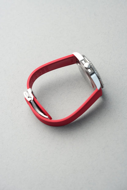 Red equestrian bit on a gray background