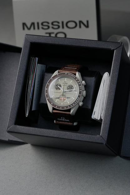 MoonSwatch Mission to Saturn in official Swatch packaging — unboxing view