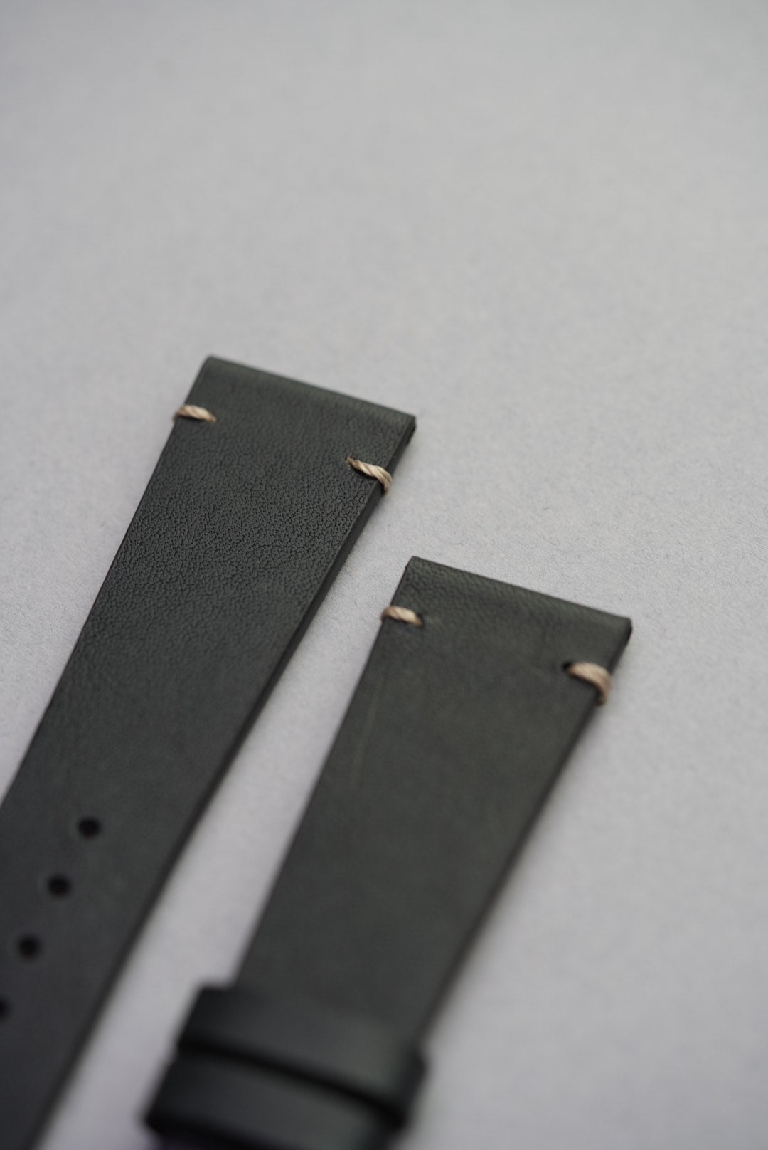 Side view of upgraded black calf leather strap fitted to Apple Watch with stitched lugs.