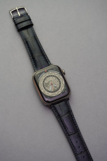  Full Apple Watch fitted with black alligator grain calfskin leather strap, elegant contrast stitching.