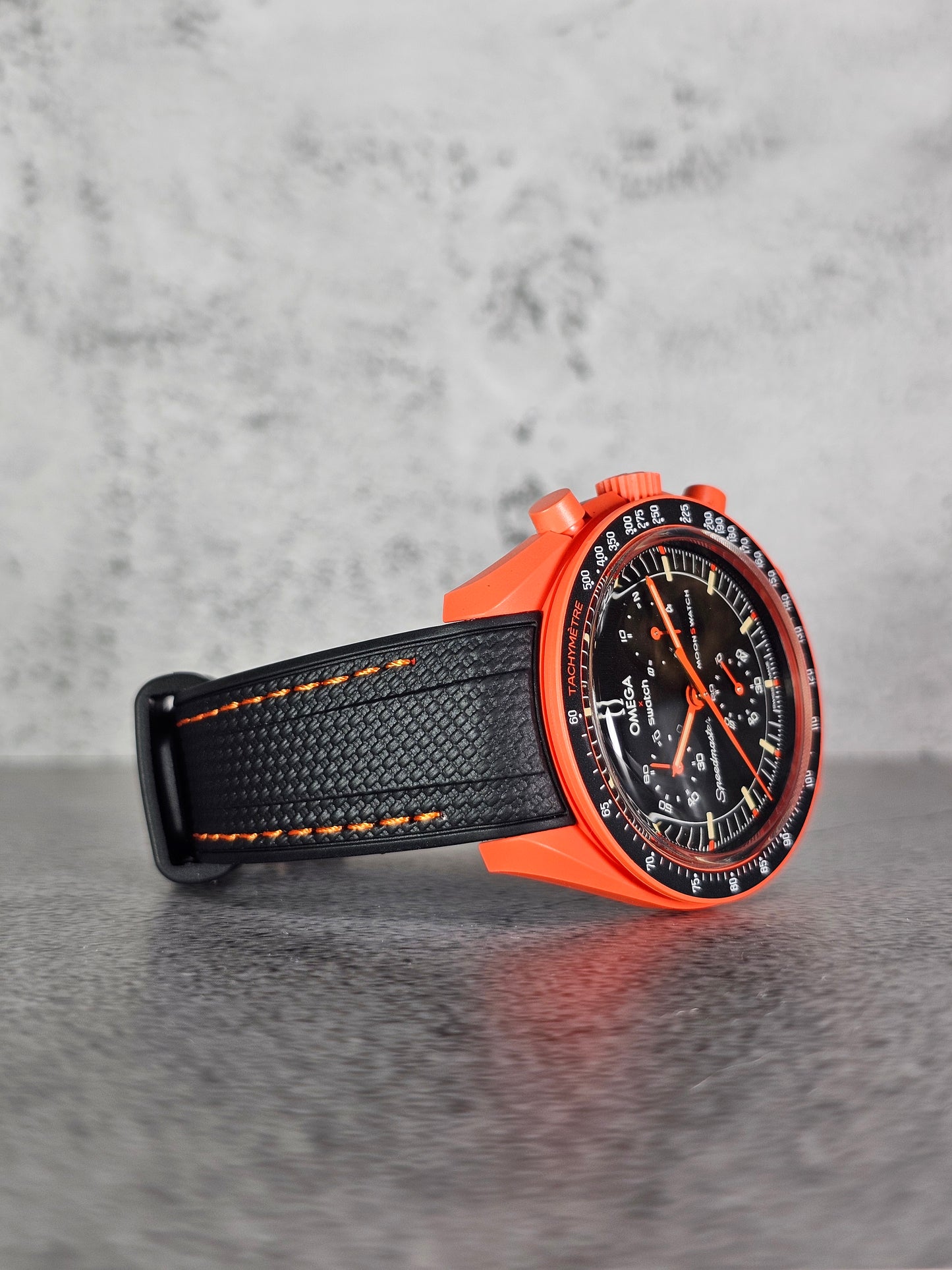 Black and lava curved rubber strap for Omega x Swatch MoonSwatch Mission on Earth Lava edition.
