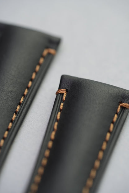 Close-up of orange stitching on Morellato black leather watch strap