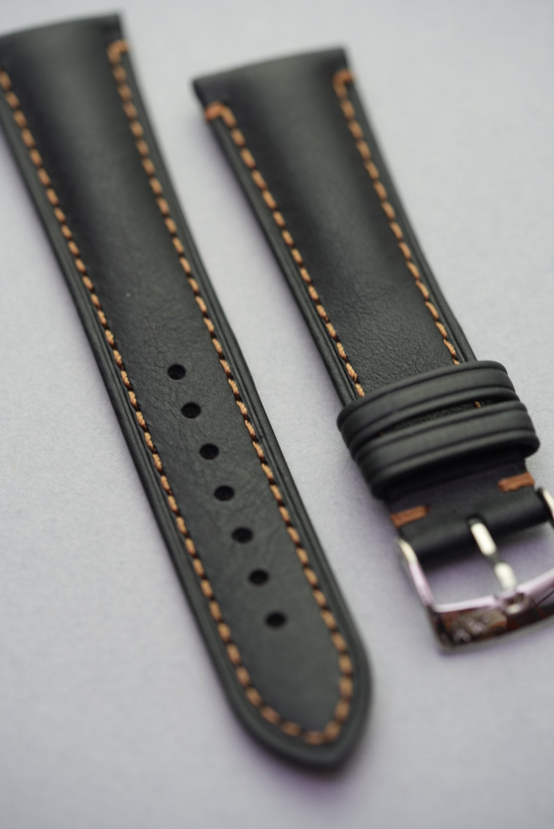 Angled side view of black leather Morellato strap for watches