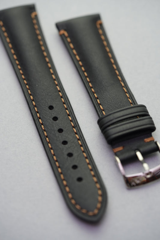 Angled side view of black leather Morellato strap for watches