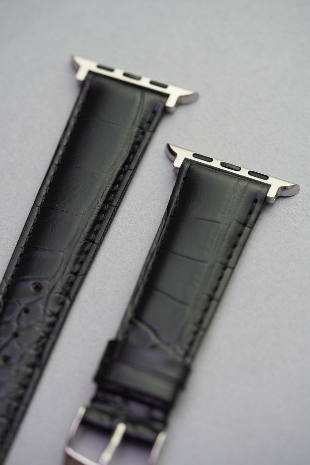 Detail view of black Louisiana alligator Apple Watch strap with curved scale finish