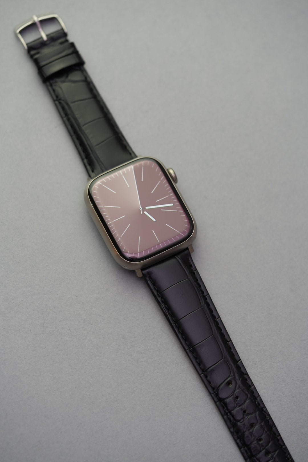Black genuine Louisiana alligator leather strap with Apple Watch adapter, front view