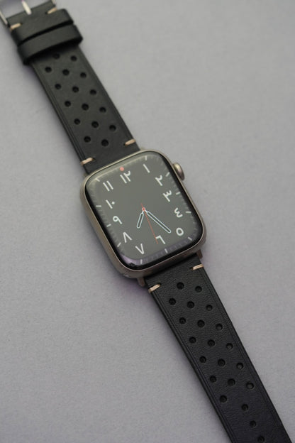 Black perforated leather strap fitted to Apple Watch face for strap replacement