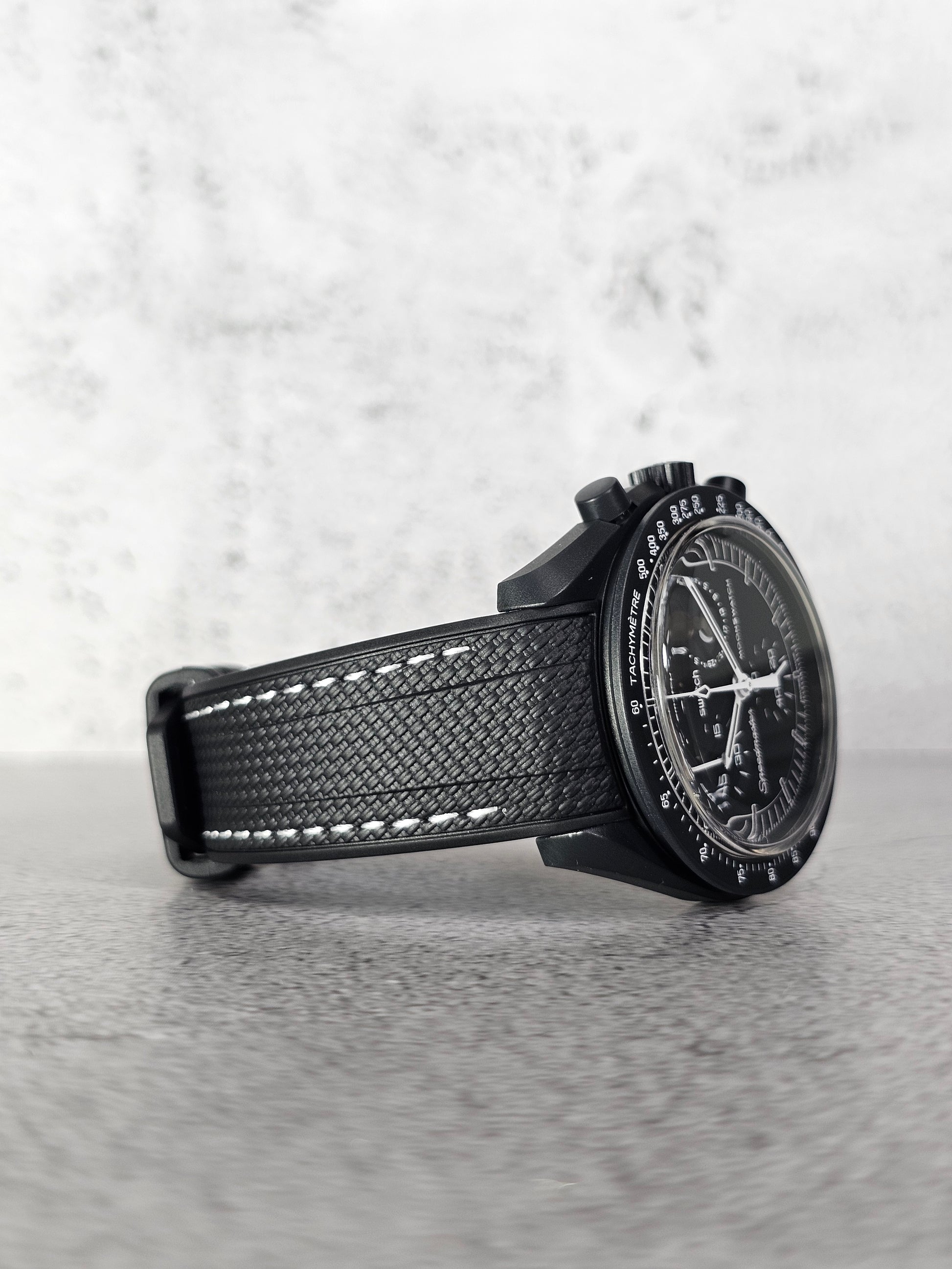 Black curved rubber strap for Omega x Swatch MoonSwatch Mission to the MoonPhase Snoopy Edition.