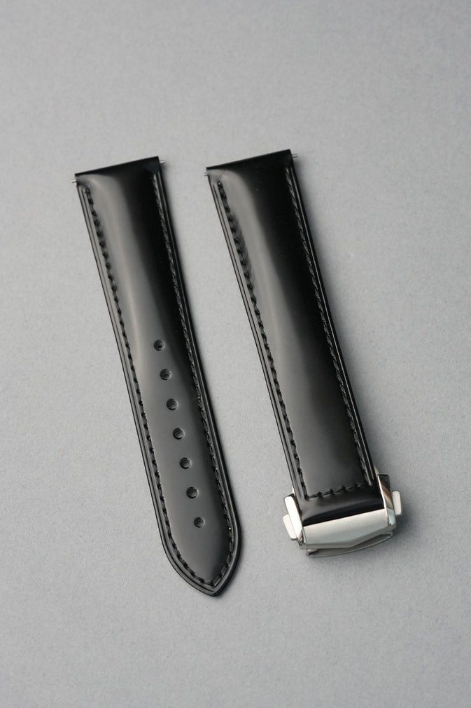 Black smooth leather deployant clasped strap flat lay MGB Watches