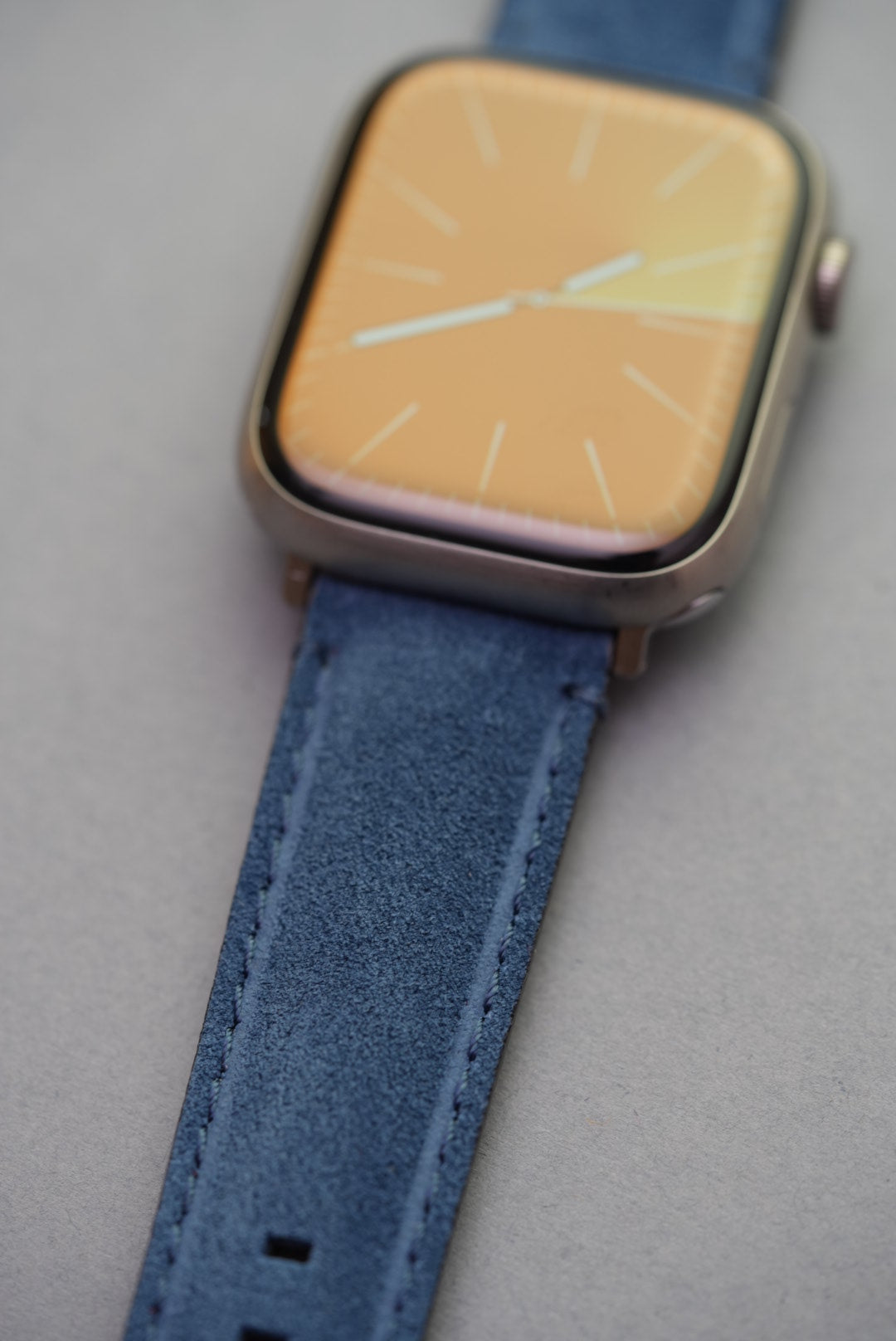 Macro close-up of blue suede strap worn on Apple Watch – soft finish, compatible with all series