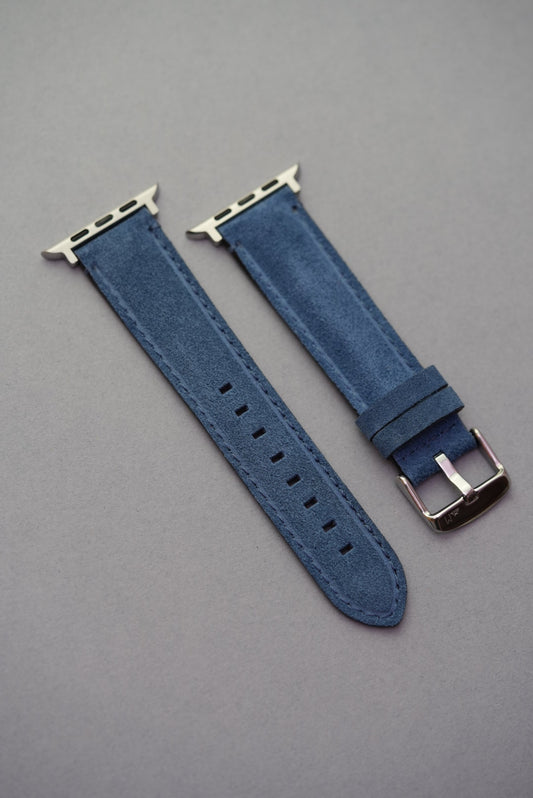 Blue suede Apple Watch strap laid flat with polished buckle – strap replacement for all Apple Watch generations