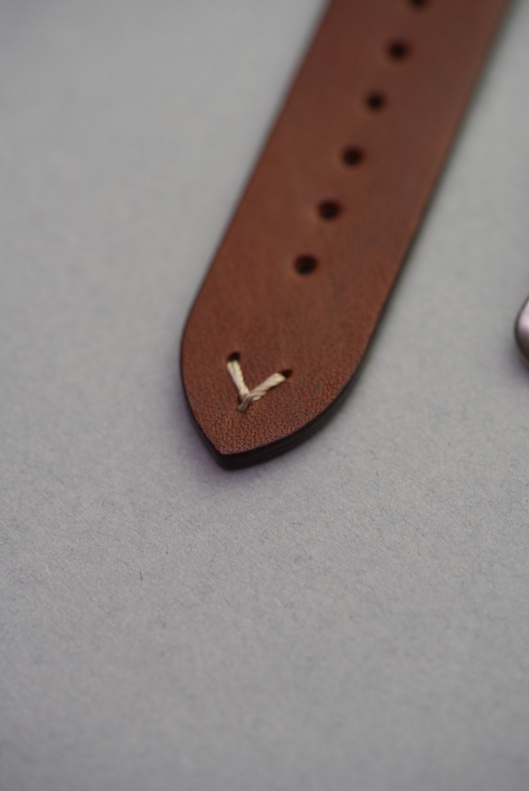 Buckle detail of brown lug-stitched calfskin leather strap, ideal for watch upgrade