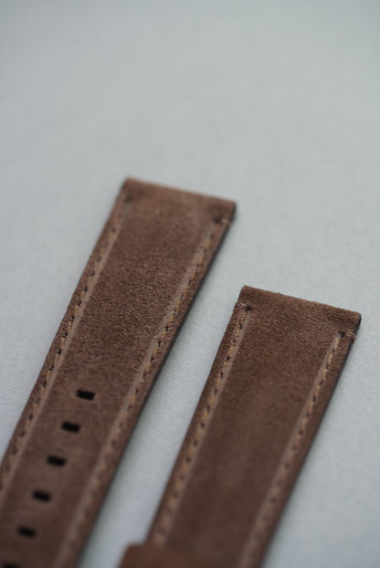 Macro detail of suede texture and stitching on brown leather watch strap for replacement