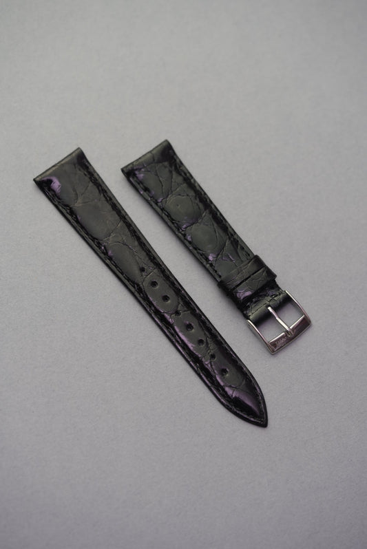  Noir black crocodile leather watch strap for Cartier, featuring subtle purple undertones and a sleek, polished grain.