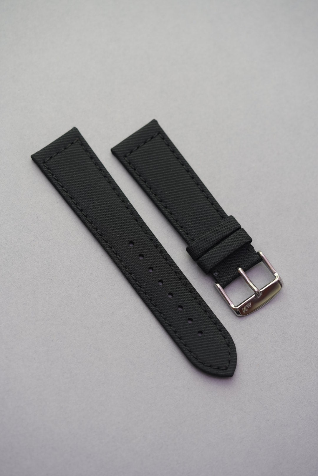 Coal black recycled fabric watch strap made from durable gabardine with a minimalist design and tone-on-tone stitching.