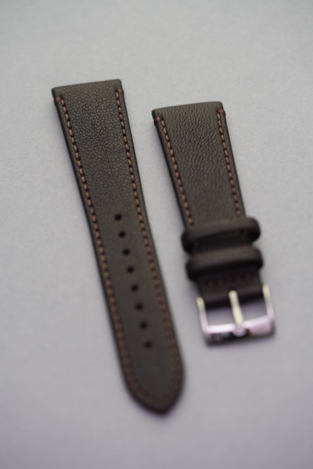 Cortado Chestnut sheepskin watch strap in deep brown with warm contrast stitching and stainless steel buckle.