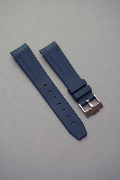 Smooth navy blue military-grade FKM rubber strap with curved lugs, perfectly matched for MoonSwatch models.