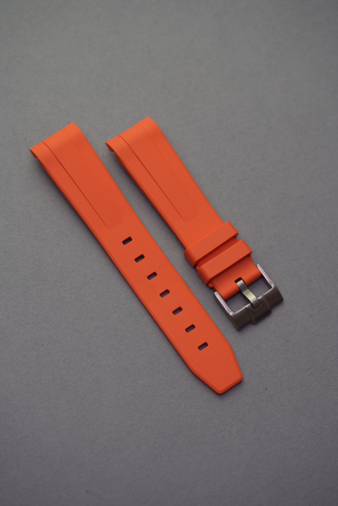 Vibrant orange curved FKM rubber strap with a military-grade build, engineered for MoonSwatch compatibility.