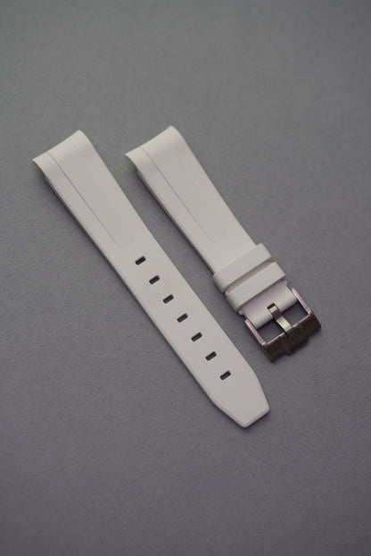 Curved-end white FKM rubber strap with a smooth finish and brushed buckle, designed to fit Omega x Swatch MoonSwatch.