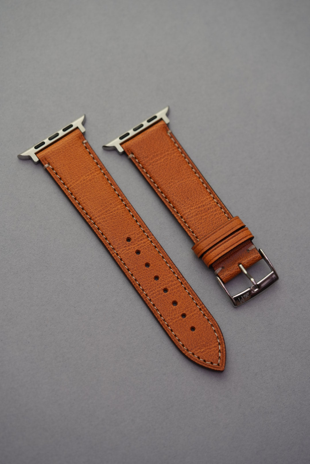 Golden brown leather watch strap with Apple Watch adapter fittings