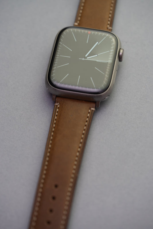 Green fine grain calf leather strap fitted to Apple Watch seen from wrist angle