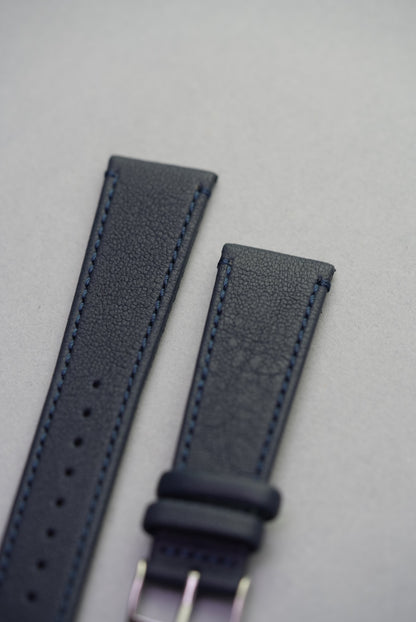 Close-up of Midnight Capri sheepskin strap buckle, highlighting stitching and grain texture.