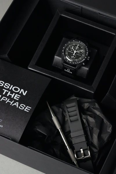 Omega x Swatch MoonSwatch Mission to the Moonphase with black rubber strap on display
