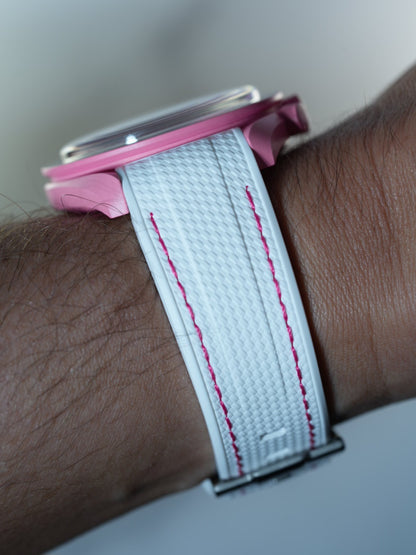 Side view of the Swatch x Omega Pink Moonphase with white textured strap and vivid pink stitching along the edge.