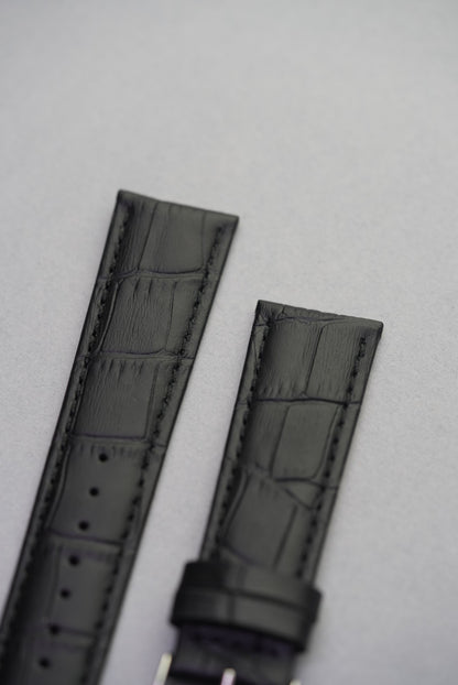 Close-up of Onyx black alligator-embossed calf leather strap – sleek textured leather watch strap replacement.