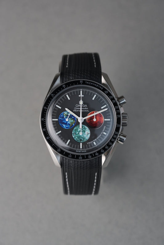 Omega watch with a detailed face on a gray background