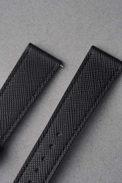 Black Italian Saffiano leather crosshatch grain texture close-up — MoonSwatch strap
