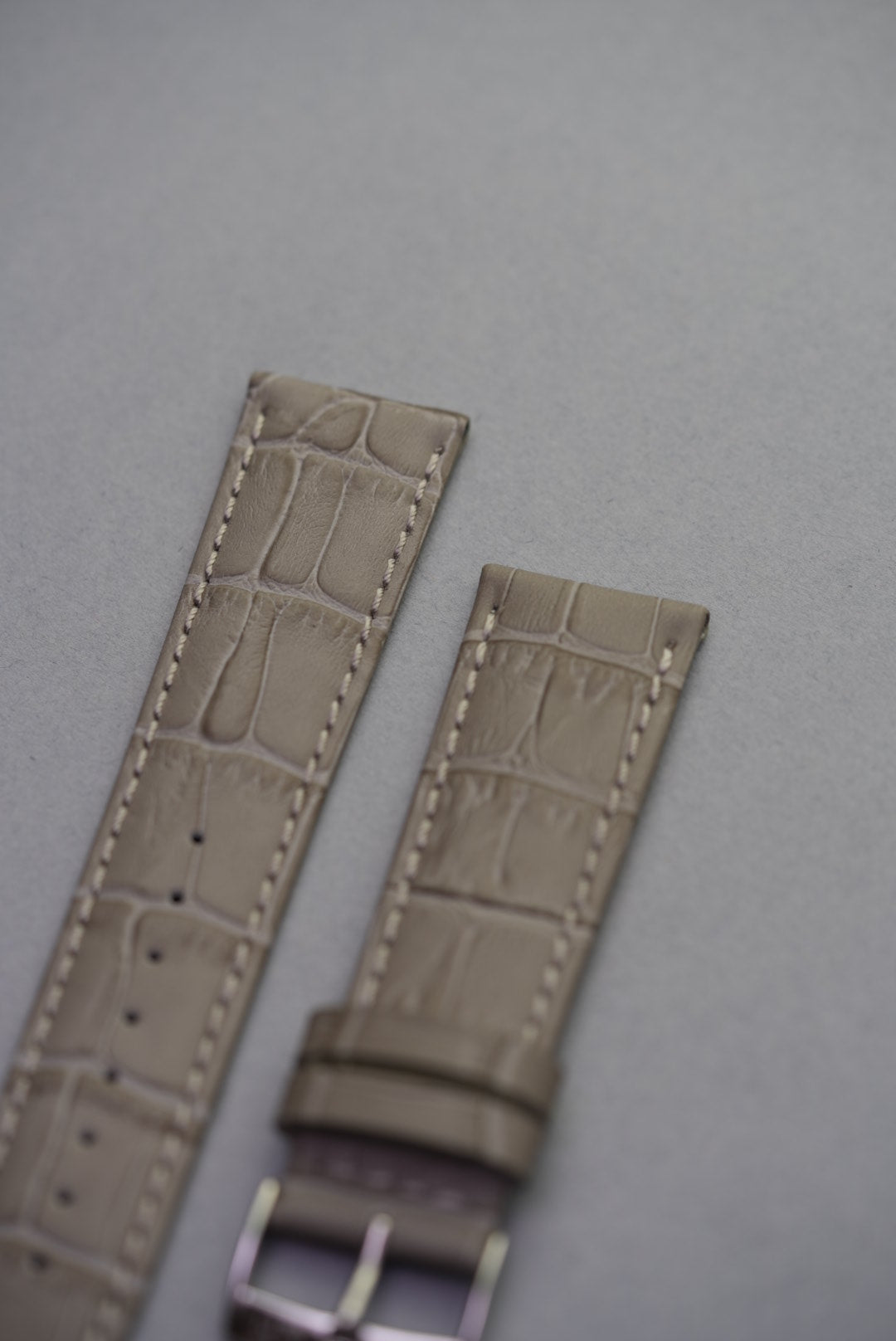 Close-up of slate grey alligator-embossed leather watch strap – luxury calfskin strap replacement with textured detail.