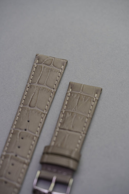 Close-up of slate grey alligator-embossed leather watch strap – luxury calfskin strap replacement with textured detail.