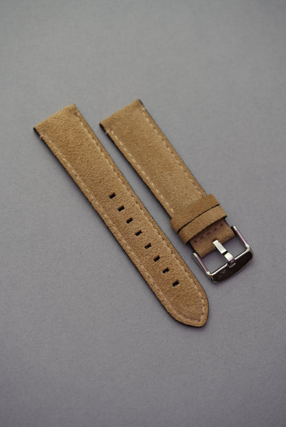 Stone suede leather watch strap laid flat with stainless buckle for strap replacement