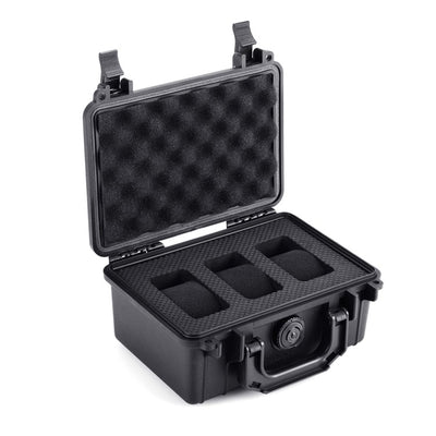 Open waterproof watch case showing foam interior with three slots for Swatch x Blancpain Fifty Fathoms watches