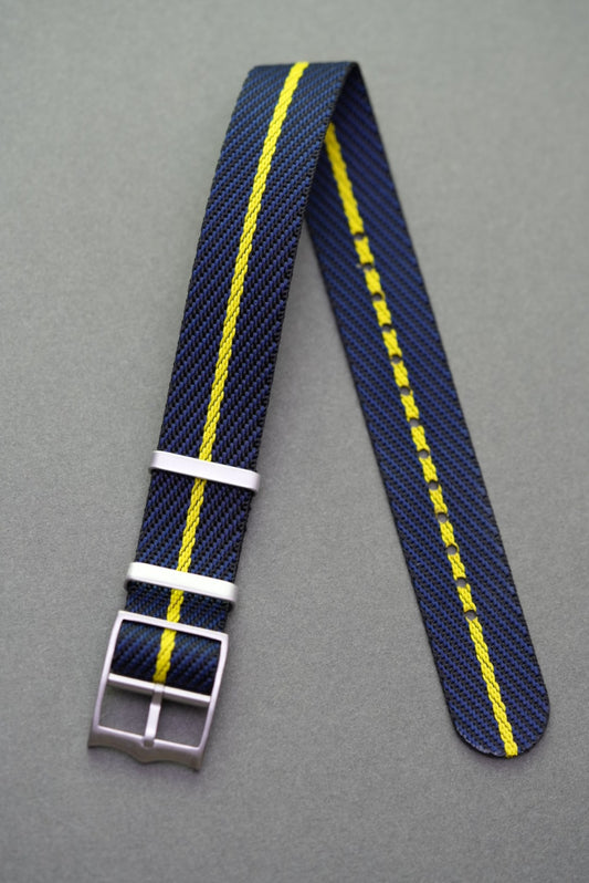 Woven nylon single-pass strap in navy with a vivid yellow centre line, made to suit Tudor models.