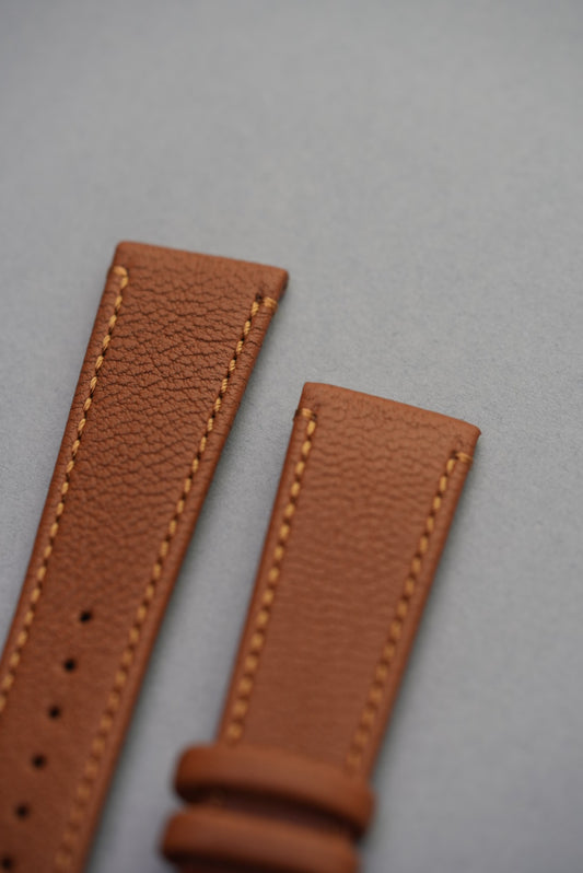 Top section of the Tuscan Sand strap showing grain texture and soft natural padding.